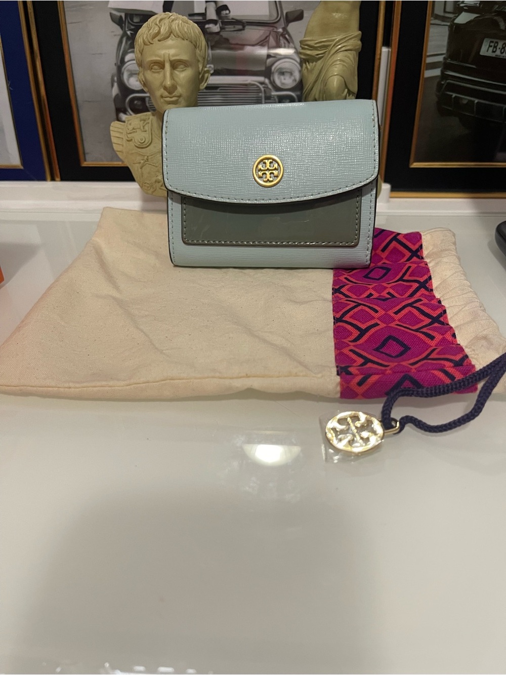 NWOT Tory Burch Light Blue Leather Wallet with Gold Logo and dust bag.